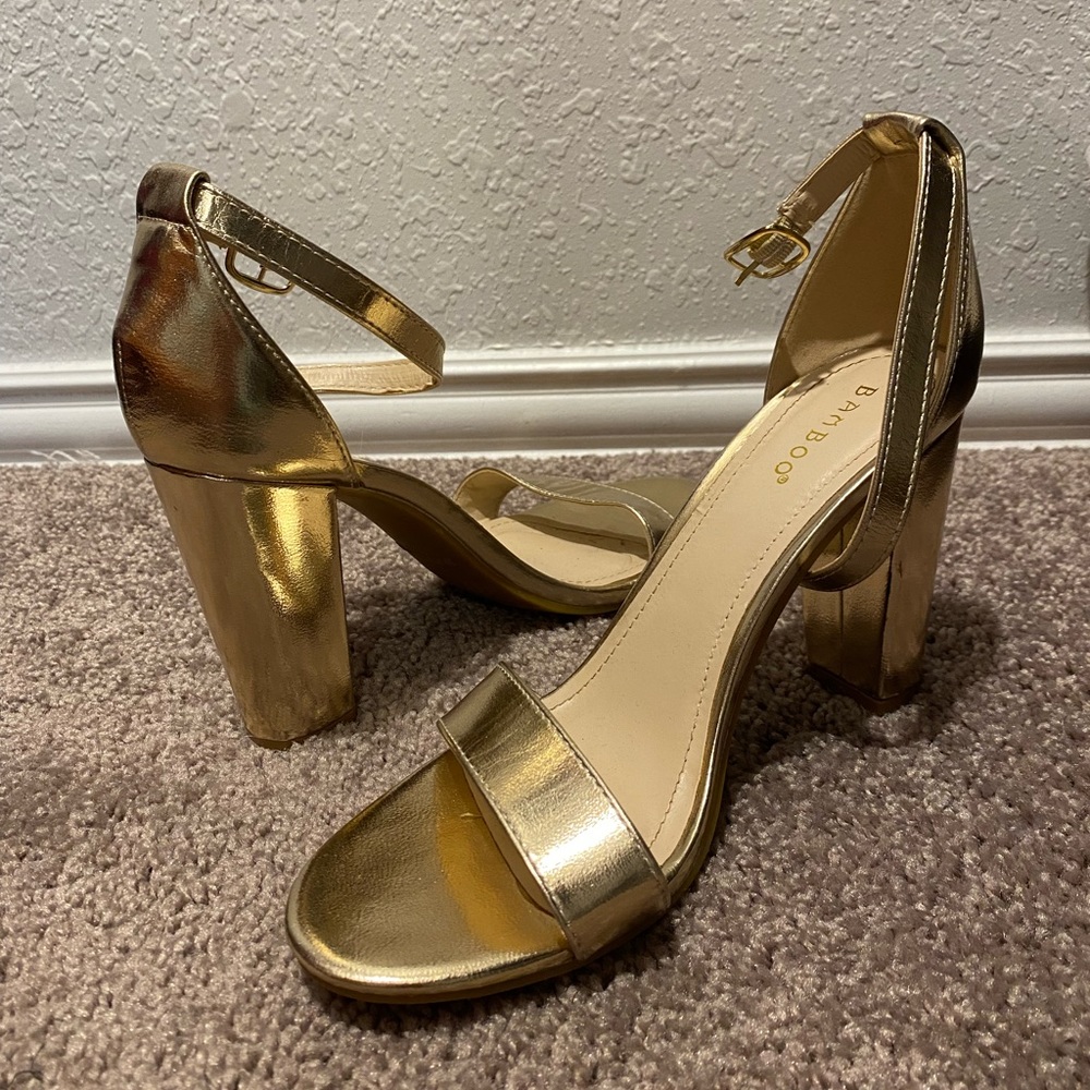 *Worn once* 4 inch gold heel.